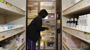 woman retrieving pharmacy item