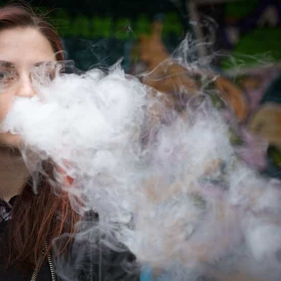 person exhaling vapor