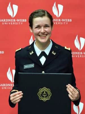 Ashley Anderson in uniform with diploma