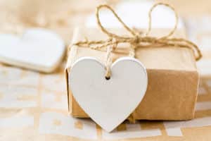 A package with a wooden heart tab