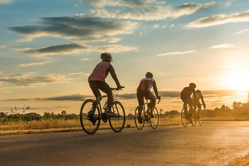 Men Bicycling at Sunset